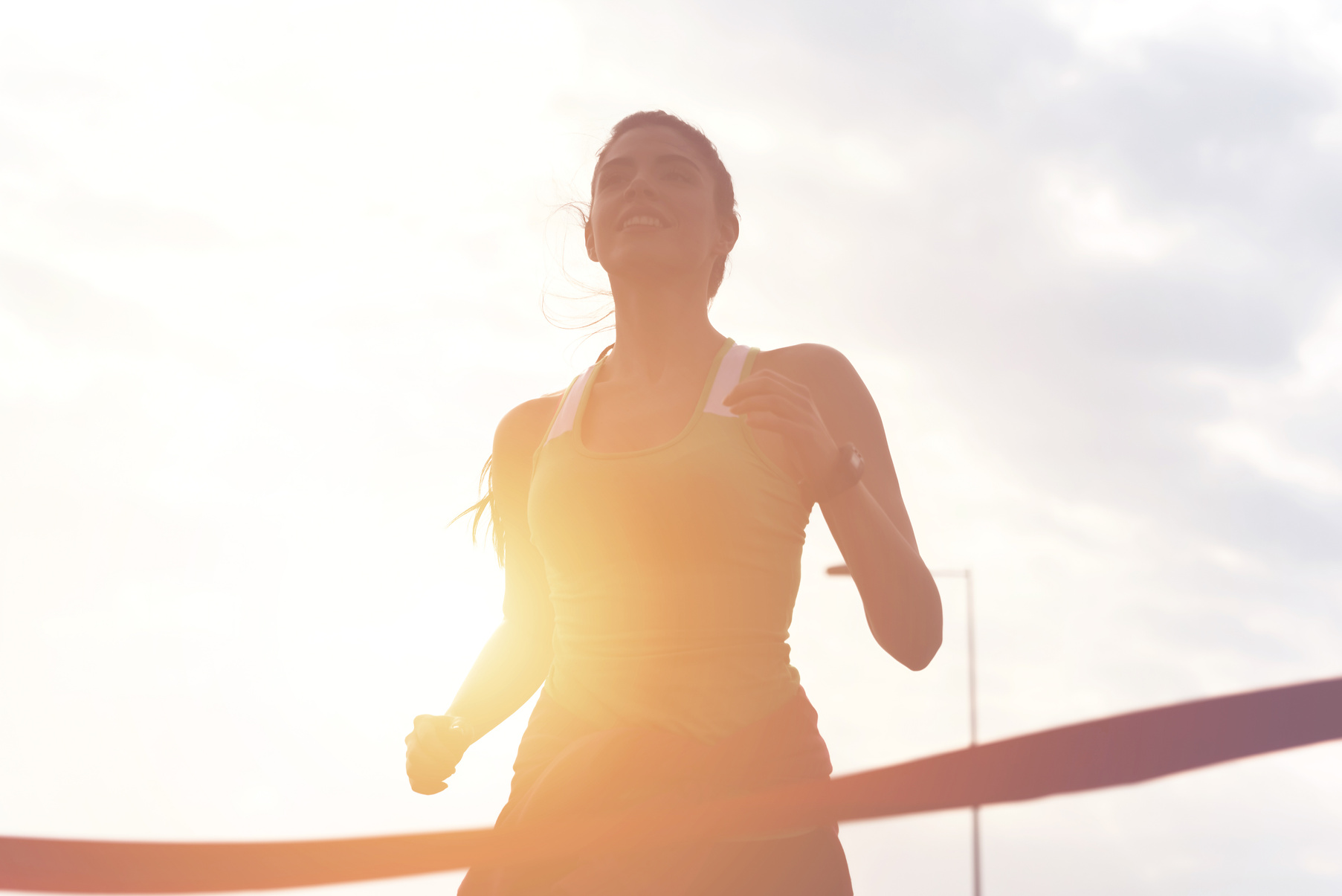 Sporty girl finishing the race